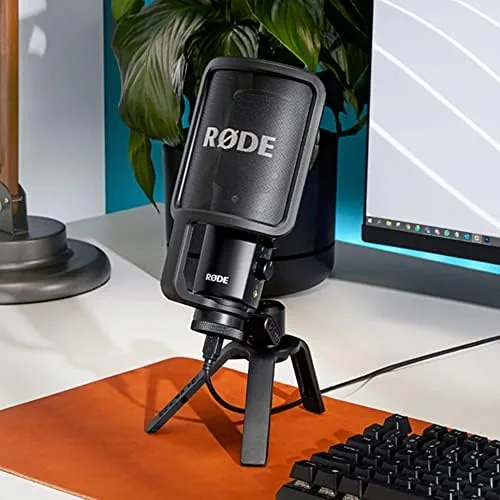 Unboxing the NT-USB showing the microphone, pop filter, tripod, and pouch