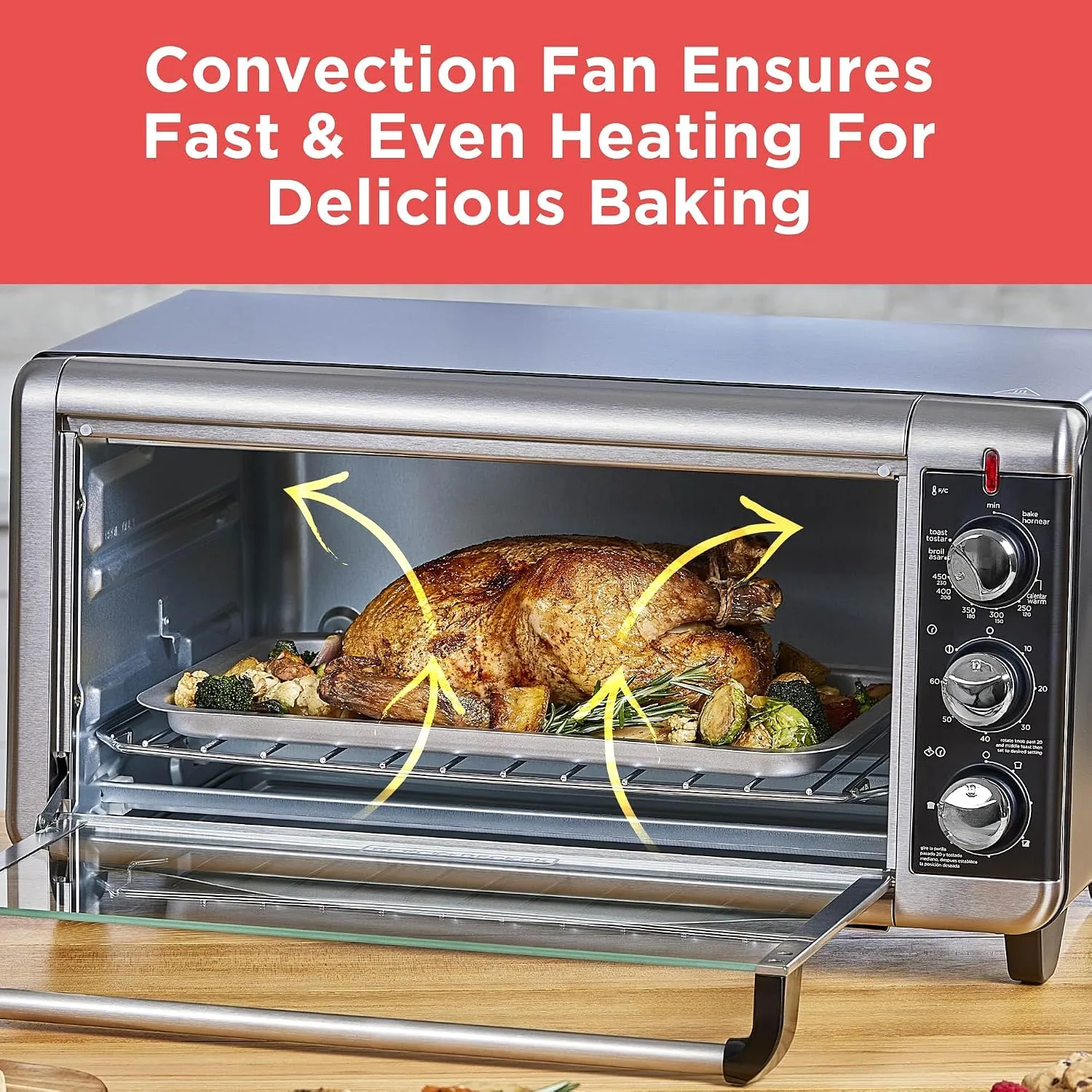 A 12-inch pizza baking in the wide interior of the toaster oven