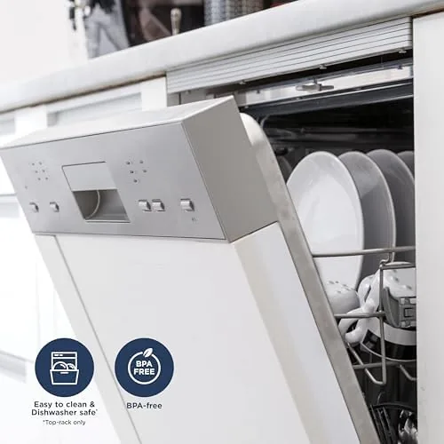 The blender pitcher and parts stacked in a dishwasher basket for cleaning