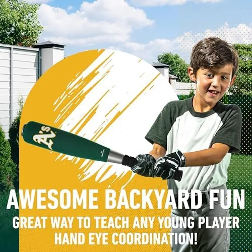Two young children taking turns swinging the foam bat outdoors