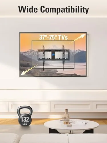 The paper template taped to the wall marking the stud positions