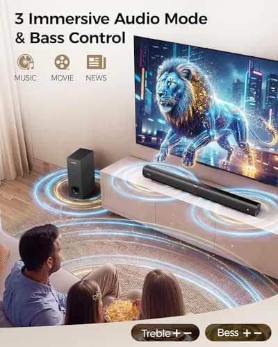 The soundbar system in a living room with the remote and microphones on a table