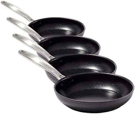 OXO skillet on a stovetop with the stainless handle visible
