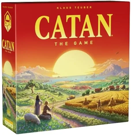 The open CATAN box showing the game board pieces and cards