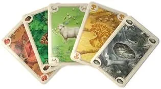 The CATAN rulebook open next to the assembled board