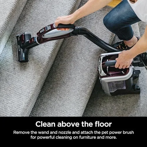 The Shark cleaning a sofa cushion with the Pet Power Brush attached