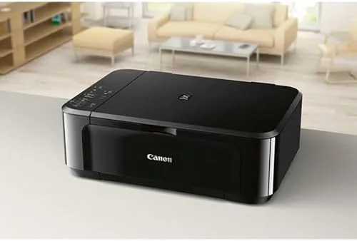 Printed color document and photo beside the MG3620 output tray