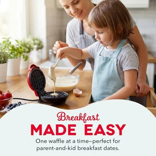 Golden waffle being lifted from the Dash Mini with a fork