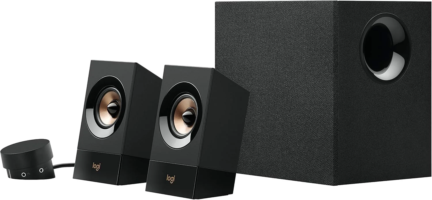 The Logitech Z533 2.1 speaker system with two satellites and a subwoofer on a desk