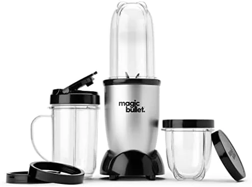 Fruit and liquid being added to a Magic Bullet tall cup before blending