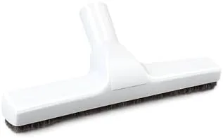 The floor brush attached to a vacuum wand at the end of a cleaning path