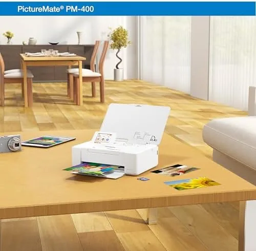 Printed family photos in frames on a shelf with the PM-400 in the background