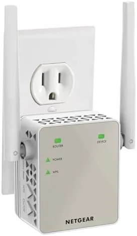 The white NETGEAR EX6120 range extender plugged into a wall outlet