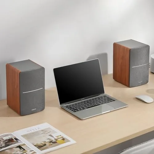 The R1280T beside a soundbar on a desk for comparison