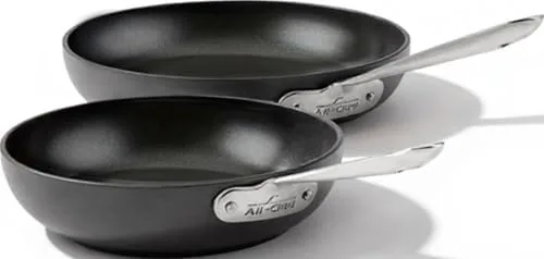 The All-Clad HA1 8 and 10 inch nonstick fry pans on a stovetop
