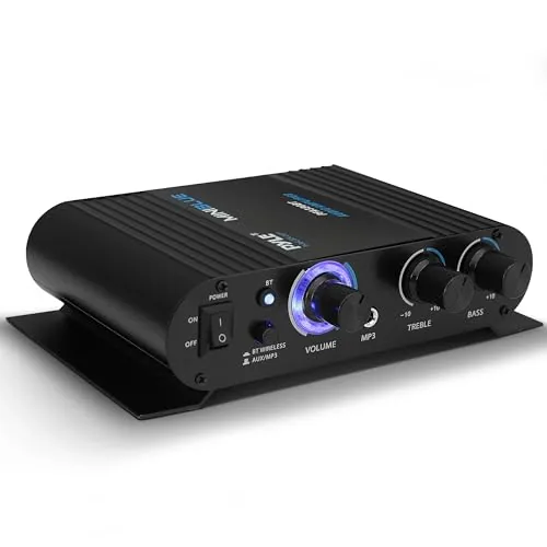 Pyle PFA330BT amplifier on a desk next to a pair of bookshelf speakers