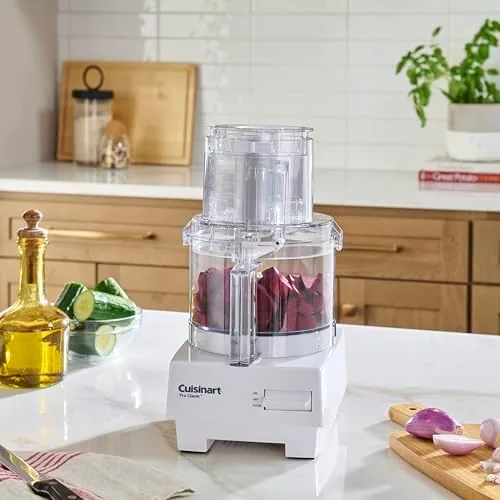 Food processor blade and reversible disc laid out on a counter