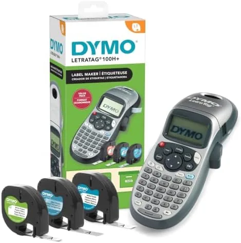 The DYMO LetraTag 100H handheld label maker with three label tape cassettes beside it