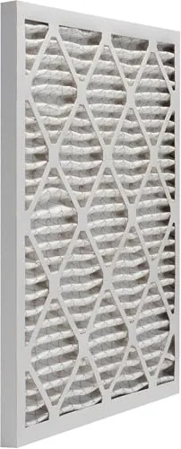 The filter sliding into a standard furnace return grill slot with a perfect fit