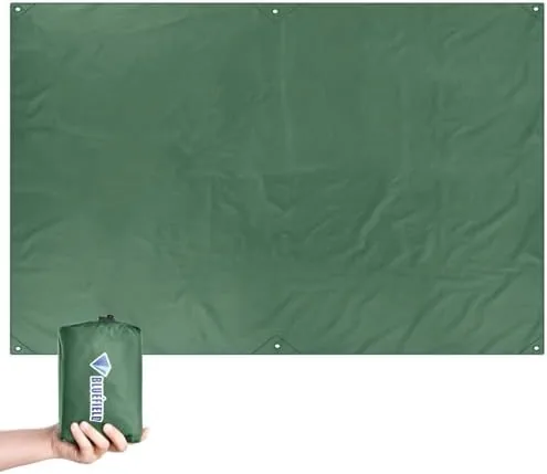 The waterproof tarp folded into a compact bundle beside a backpack