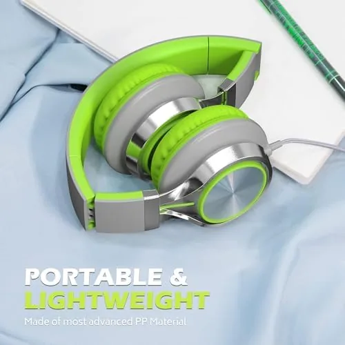 The folded headphones packed in a carry-on bag next to a tablet