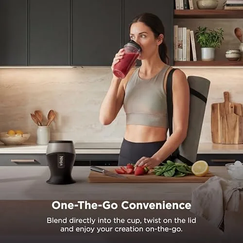 A smoothie poured from the Ninja Fit cup into a tall glass