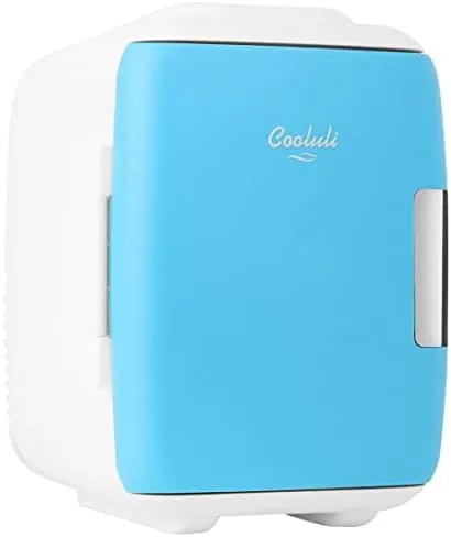 The Cooluli mini fridge in blue sitting on a desk with a can beside it