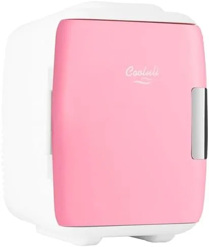 The pink Cooluli mini fridge on a dresser in a bedroom