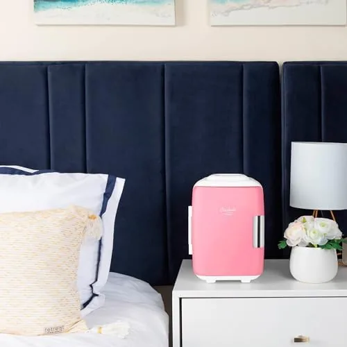 The pink Cooluli on a desk with skincare bottles beside it