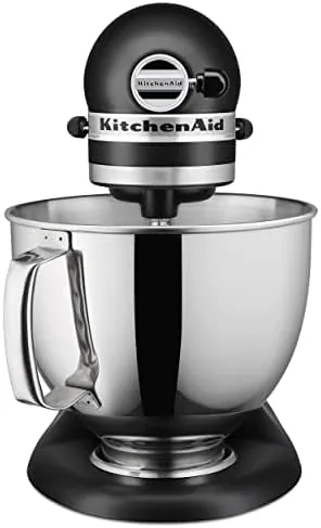The tilt head lifted to show the 5 quart bowl and attachments