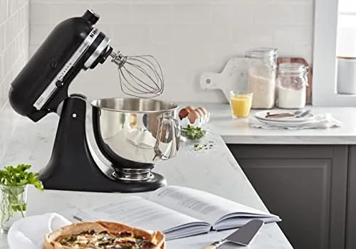 A fresh baked cake beside the black matte Artisan mixer