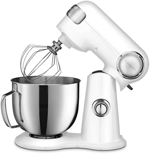 The 5.5 quart stainless steel bowl and attachments beside the mixer