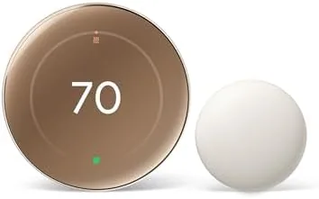 Front view of the Google Nest Learning Thermostat 4th Gen in Polished Gold mounted on a wall