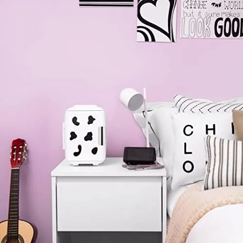The Cooluli mini fridge on a nightstand next to a skincare routine laid out