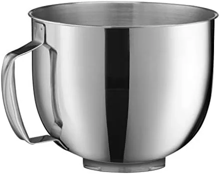 Splash guard with pour spout fitted over the mixing bowl