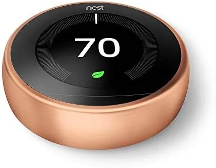Side by side of the Nest Learning thermostat and a plain programmable thermostat