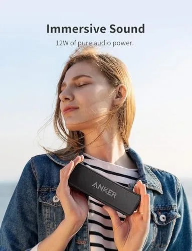 Soundcore 2 speaker playing music on a patio table outdoors