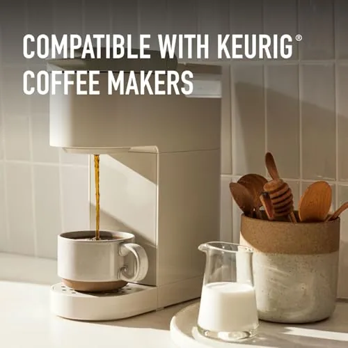 The Peet's box on a kitchen counter next to a full mug of dark roast