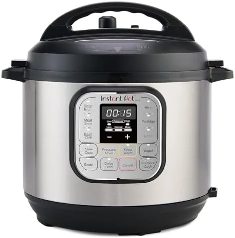 The red Instant Pot Duo Mini on a kitchen counter with the steam valve closed