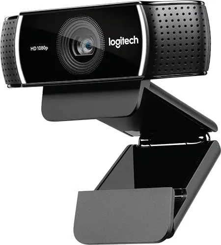 A streaming setup with the C922 on a tripod beside a ring light