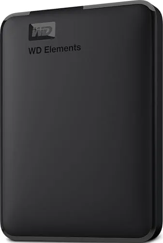 The WD 4TB Elements drive resting on a desk next to a laptop