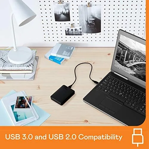 The WD Elements drive on a shelf beside photo albums and boxes