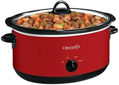 The removable stoneware insert lifted out of the Crock-Pot showing its capacity and handles