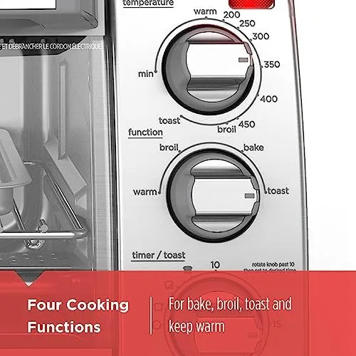 The interior of the toaster oven with the rack and removable crumb tray visible