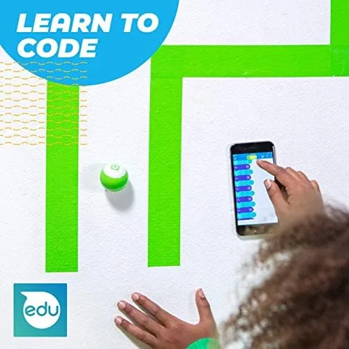 Two kids working together on a Sphero Edu coding activity on the floor