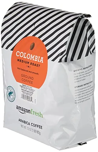 The resealable zipper top of the coffee bag opened for scooping