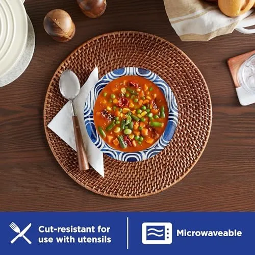 A bowl of hot soup being held at the table without any leakage