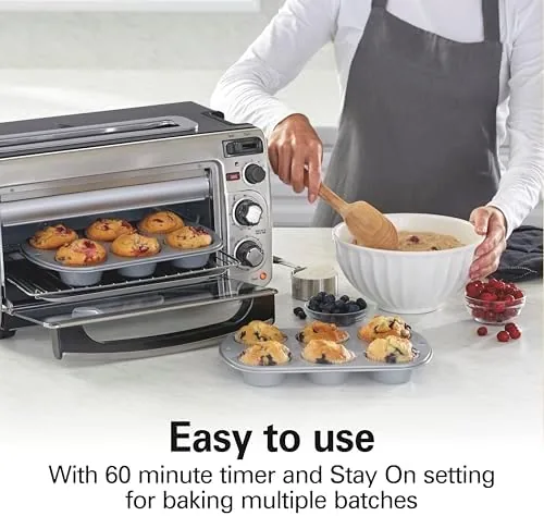 A casserole with a broiled top being checked in the open oven door