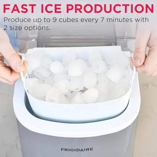 The ice maker's removable water reservoir lifted out for refilling