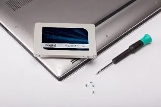 Close up of the Crucial MX500 SATA connector and drive label